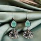 Mint Green Stone Oxidised Silver Jhumka Earrings